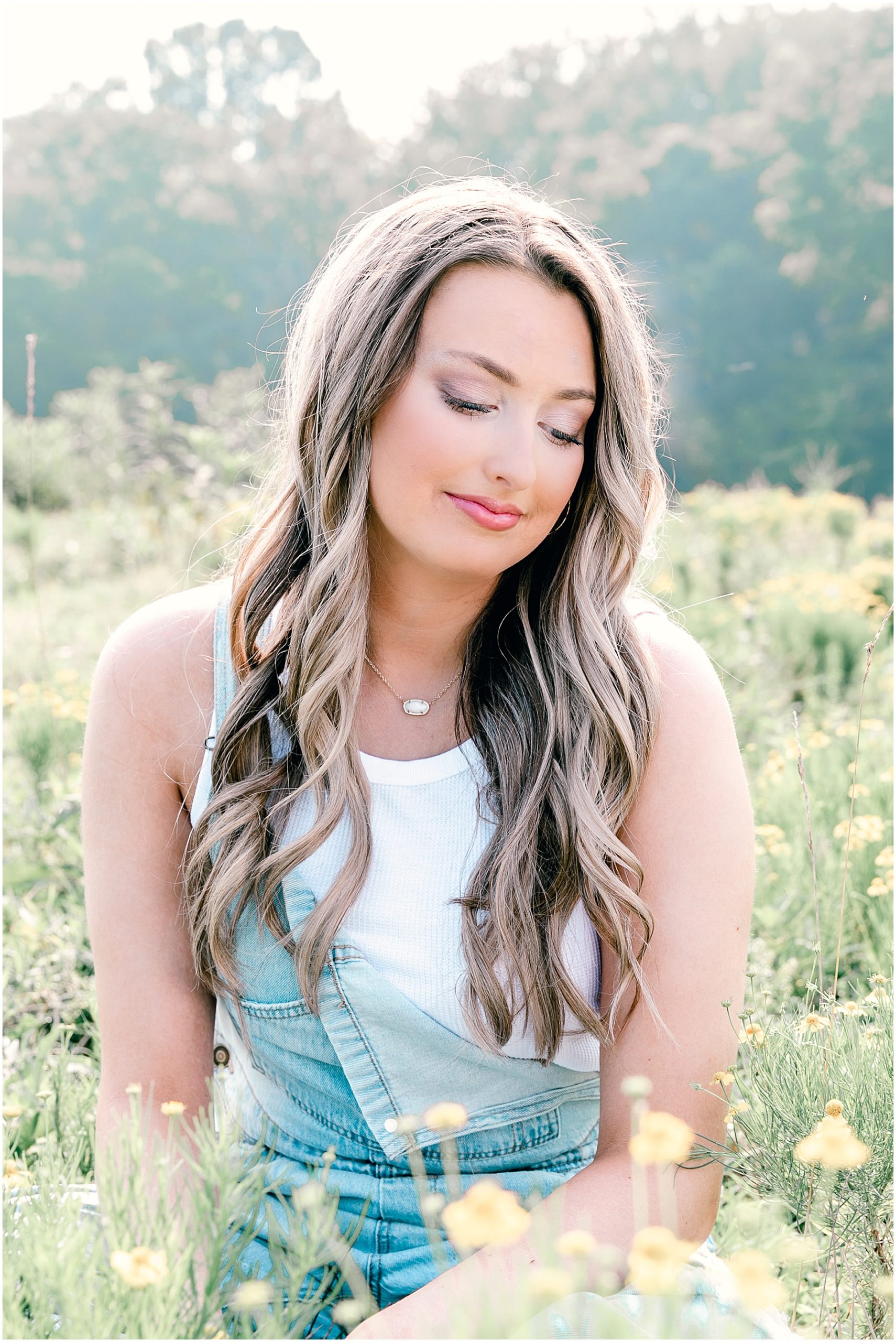 Nashville Senior Pictures on the Farm with wildflowers and morning sunshine